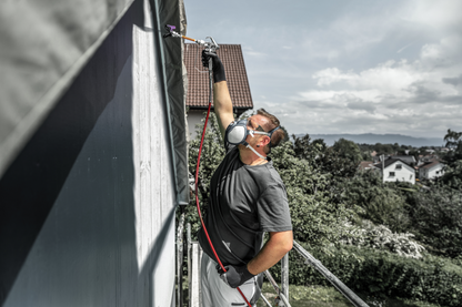 Rallonge Titan pour pistolet de peinture airless utilisée pour des travaux de peinture extérieure